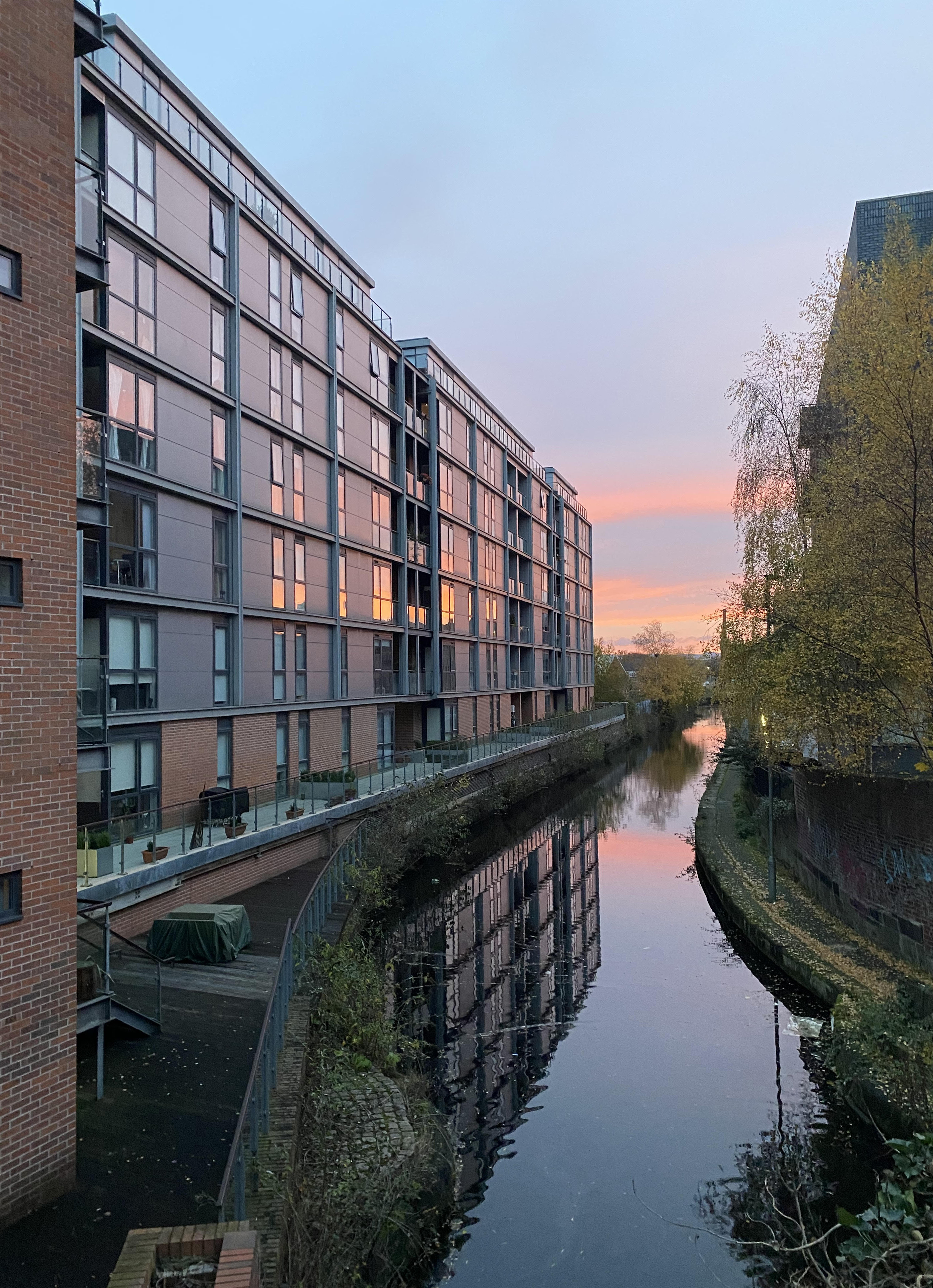 Flint Glass Wharf apartments next to Rochdale Canal at sunset